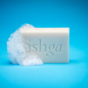 ishga Shampoo &amp; Body Bar next to some water