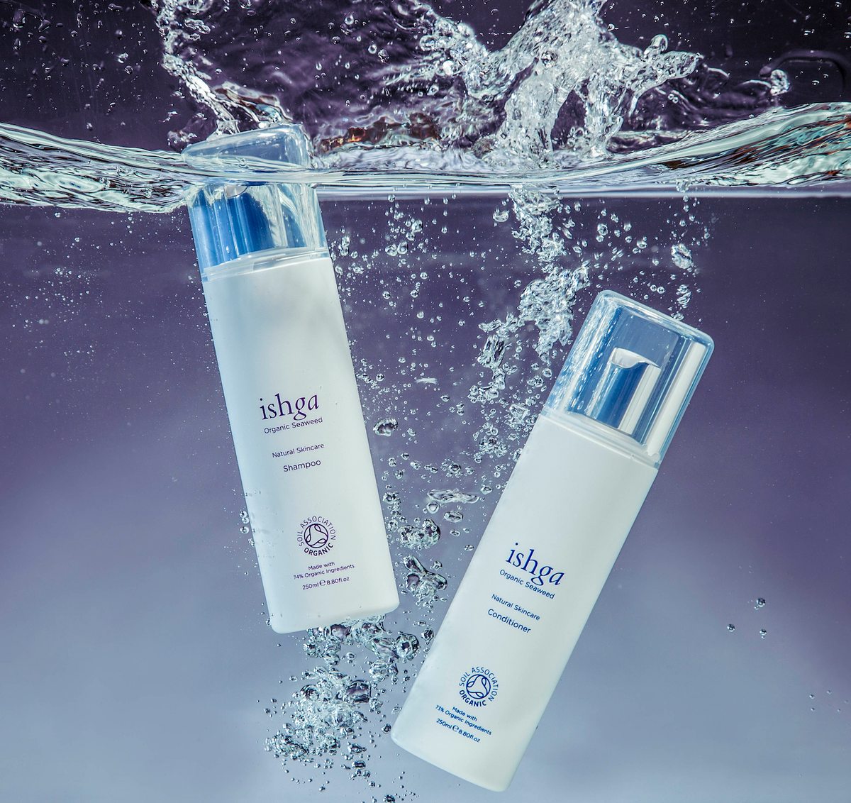 A bottle of ishga Organic Seaweed Shampoo and Conditioner in water