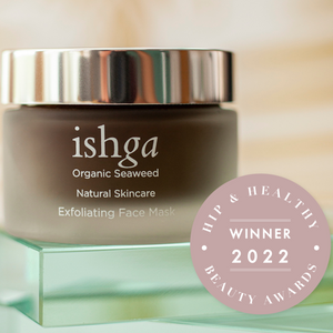 Jar of ishga Exfoliating Face Mask opened with lid next to it