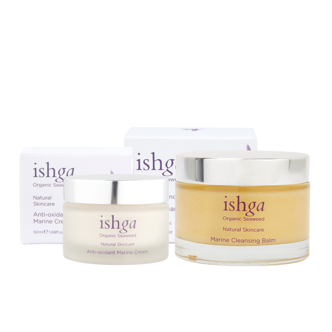 Jar of ishga Anti-oxidant Marine Cream next to a jar of ishga Marine Cleansing Balm, with their boxes behind them