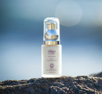 Small bottle of ishga Active Cleansing Lotion on a rock outside