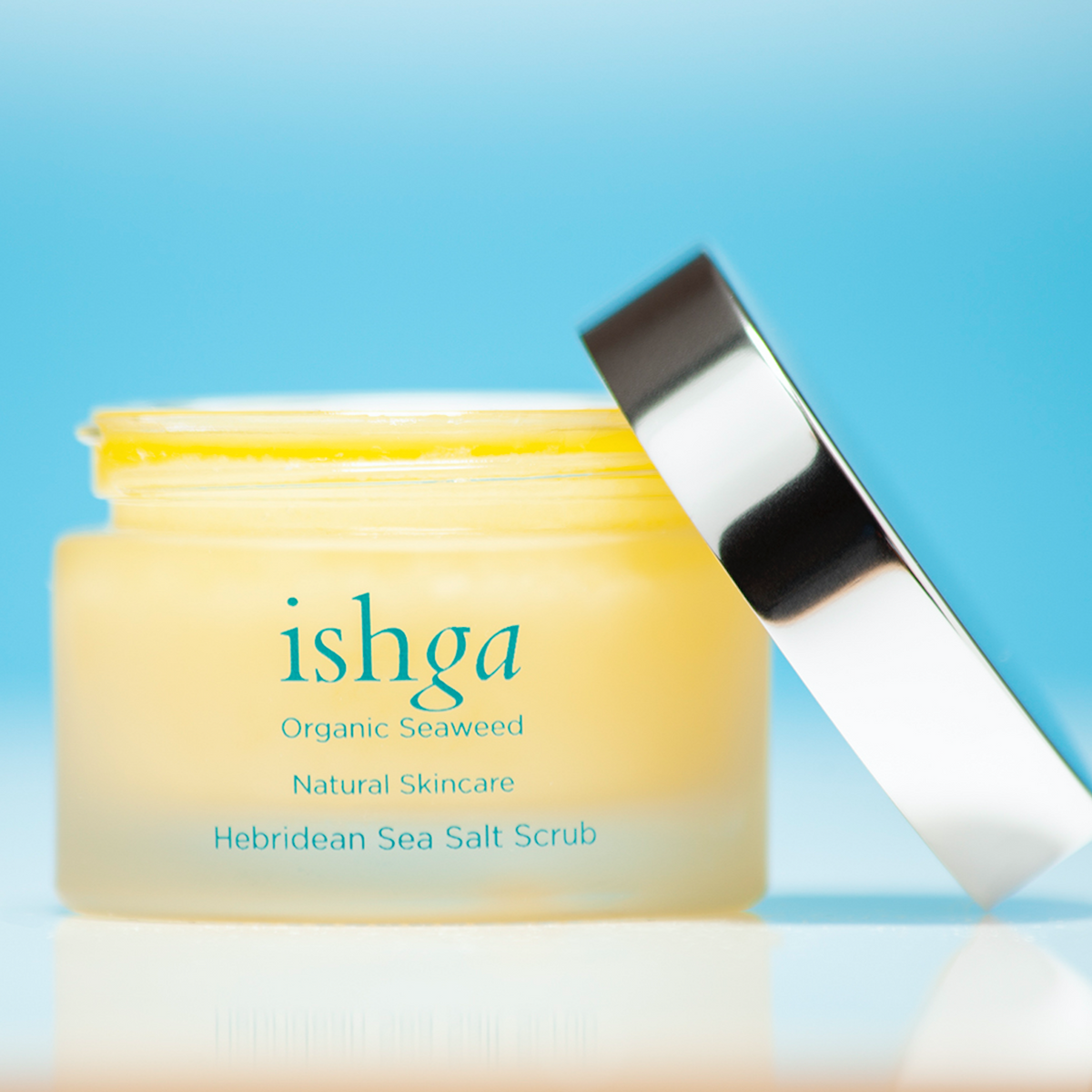 ishga Hebridean Sea Salt Scrub 50ml glass jar opened with lid next to it Seaweed skincare product made with organic ingredients, vegan and cruelty free, made in Scotland 