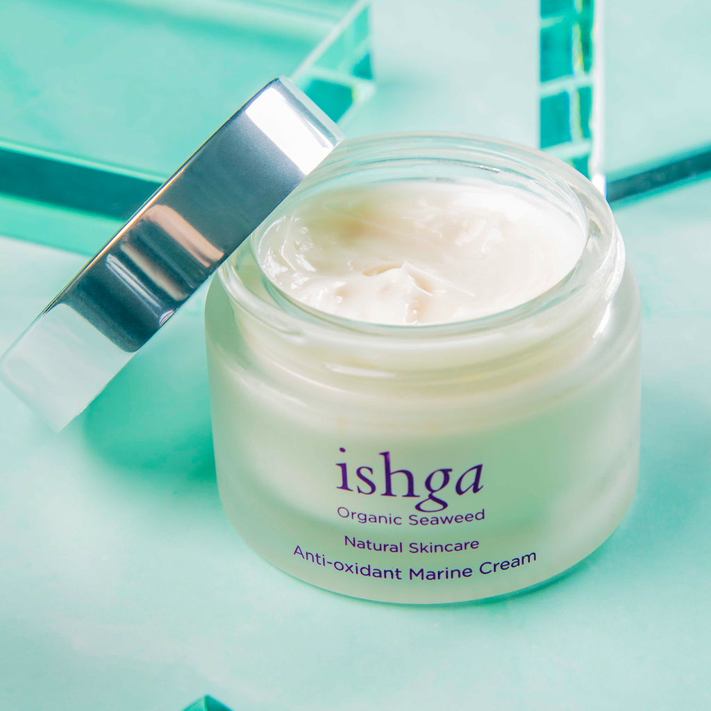 Opened jar of ishga Anti-oxidant Marine Cream with its lid next to it