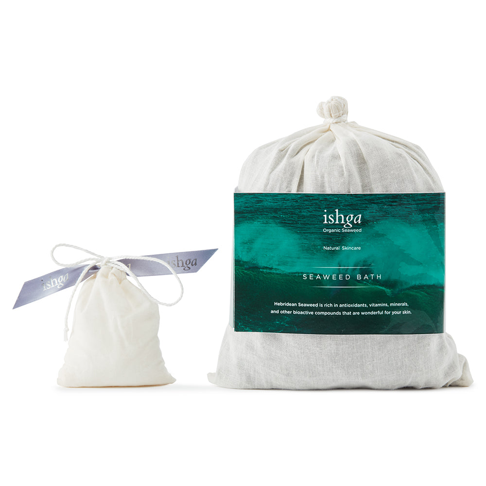 A large bag of ishga Seaweed Bath next to a small bag of ishga Invigorating Bath Salts