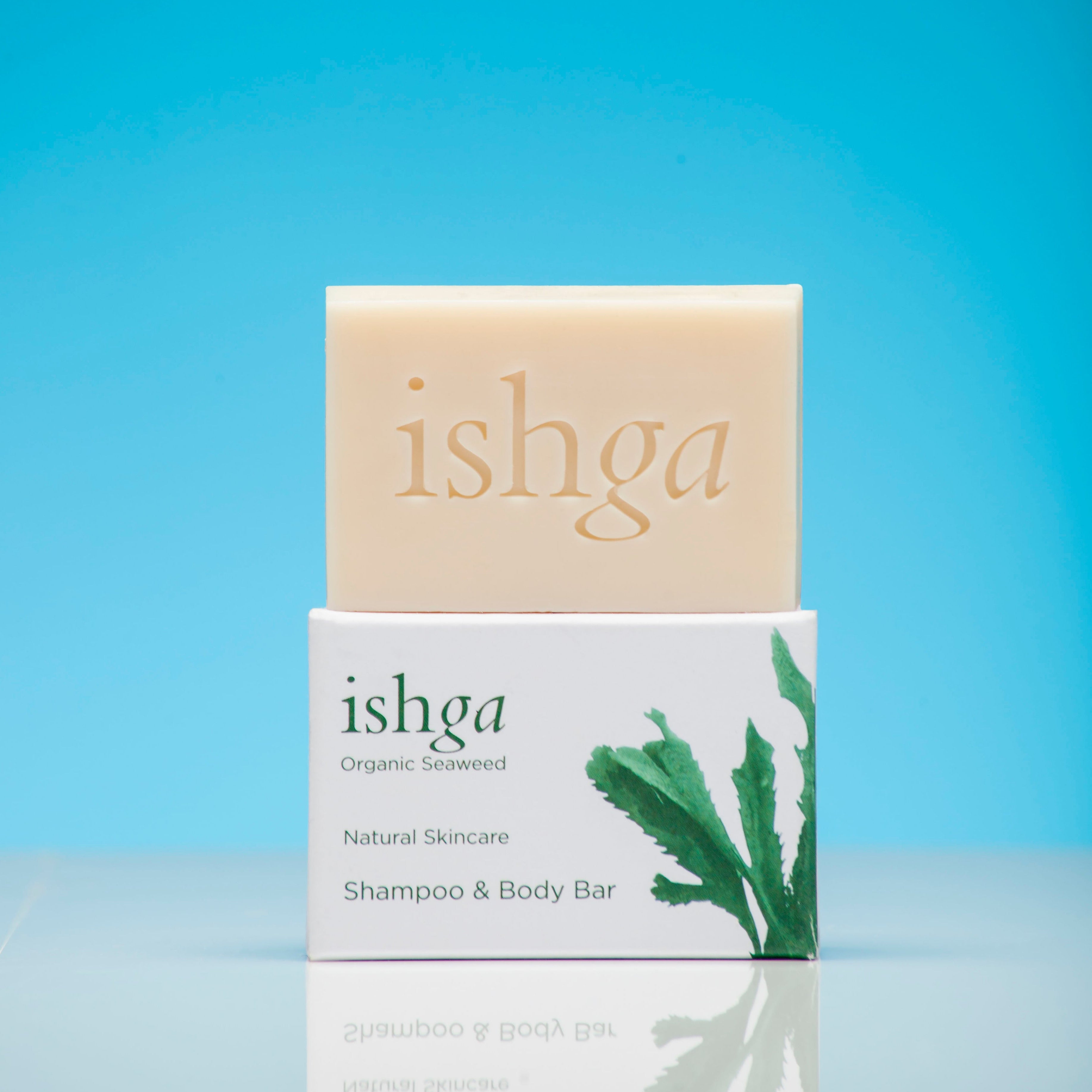 Bar of ishga Shampoo & Body Bar sitting on top of its box
