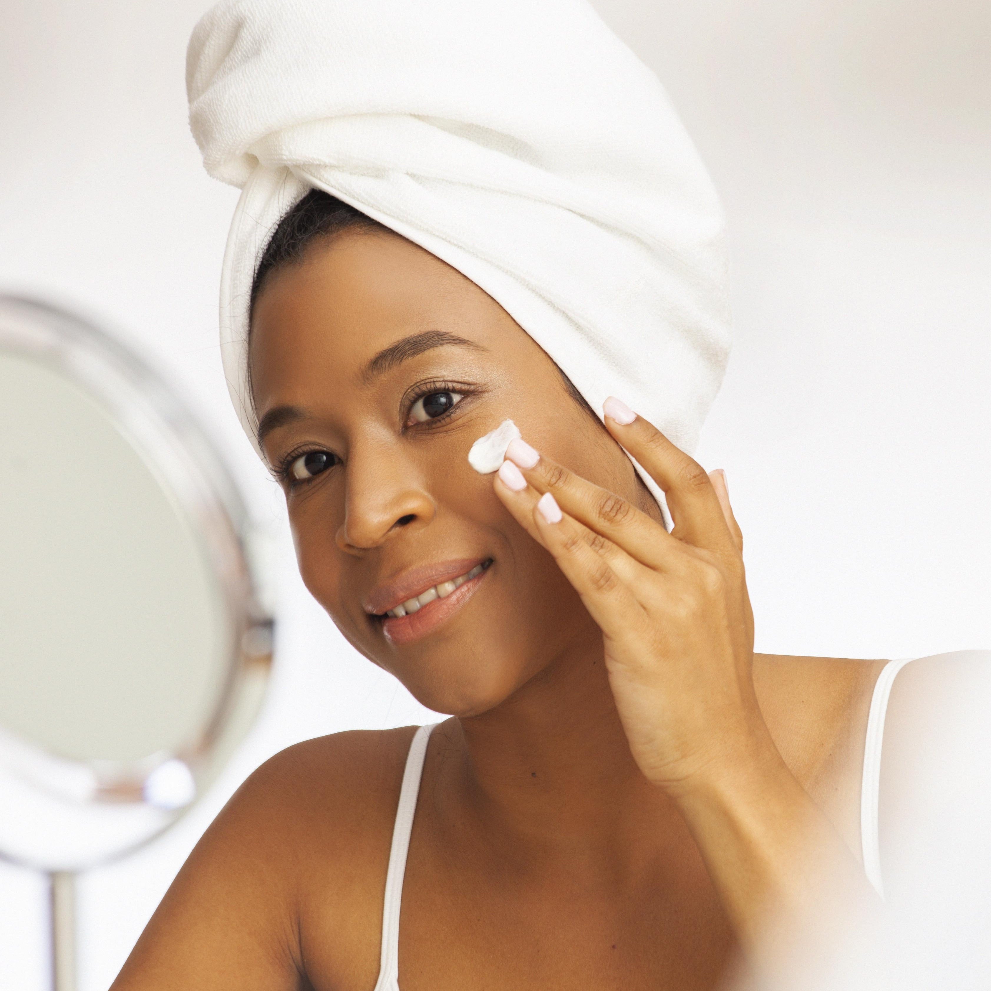 Lady rubs some ishga Anti-oxidant Marine cream into her face